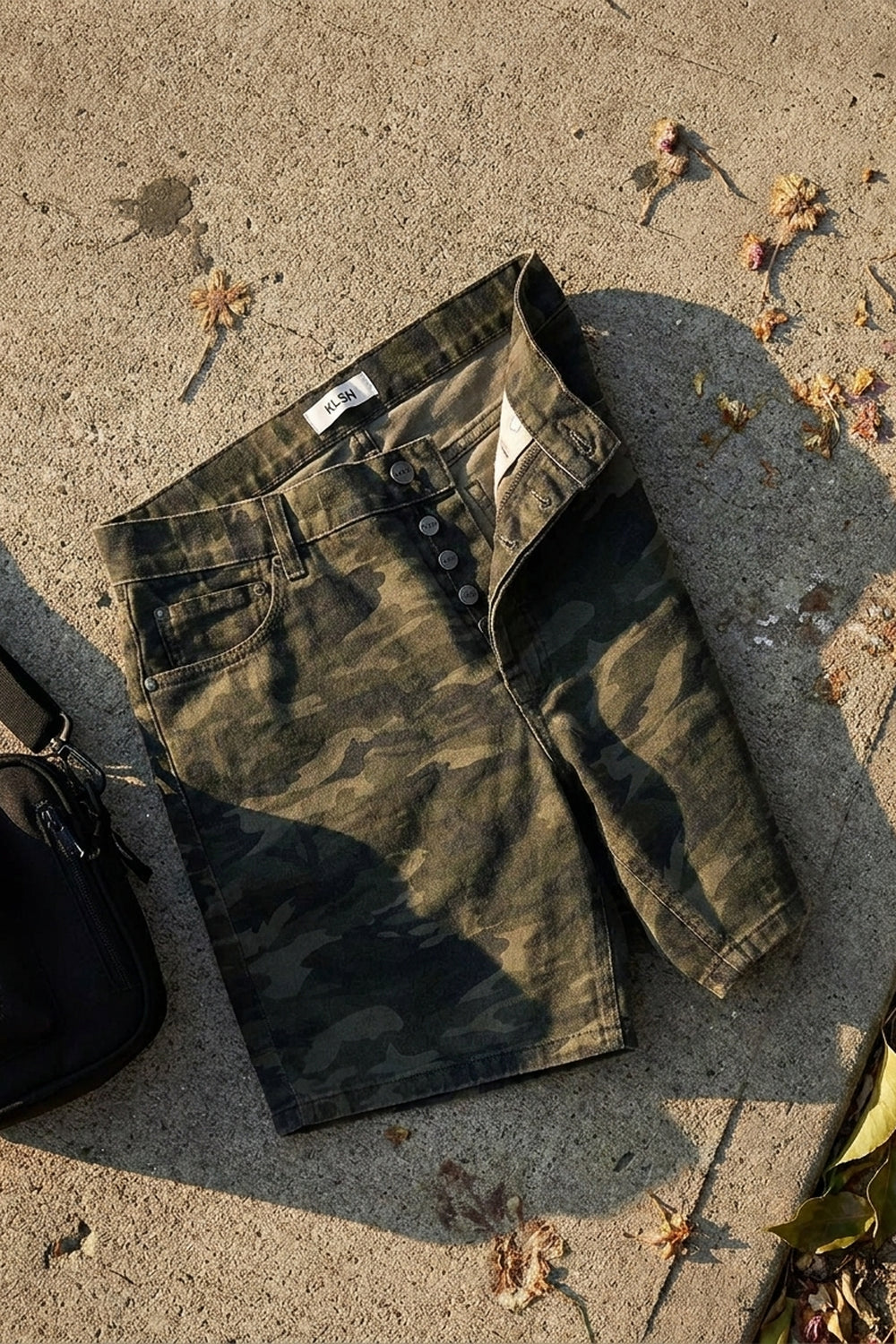 BLAKE OVERSIZED DENIM SHORTS Splatter Camo men's knolling flat lay
