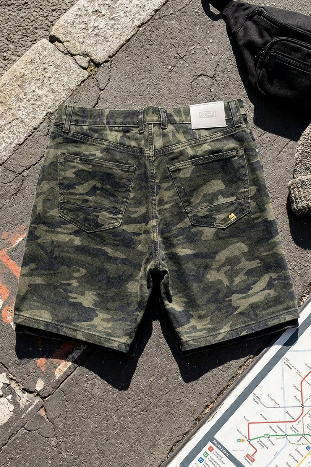 BLAKE OVERSIZED DENIM SHORTS Splatter Camo women's knolling flat lay