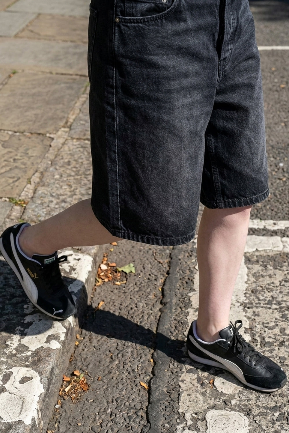BLAKE OVERSIZED DENIM SHORTS Faded Black women's hem and shoe detail