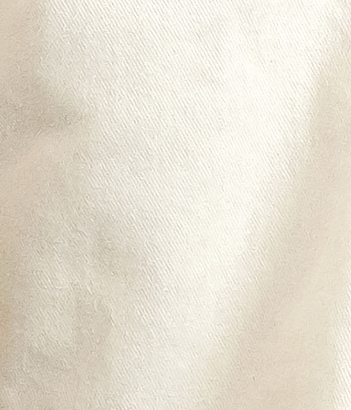 Close-up of a textured beige fabric surface