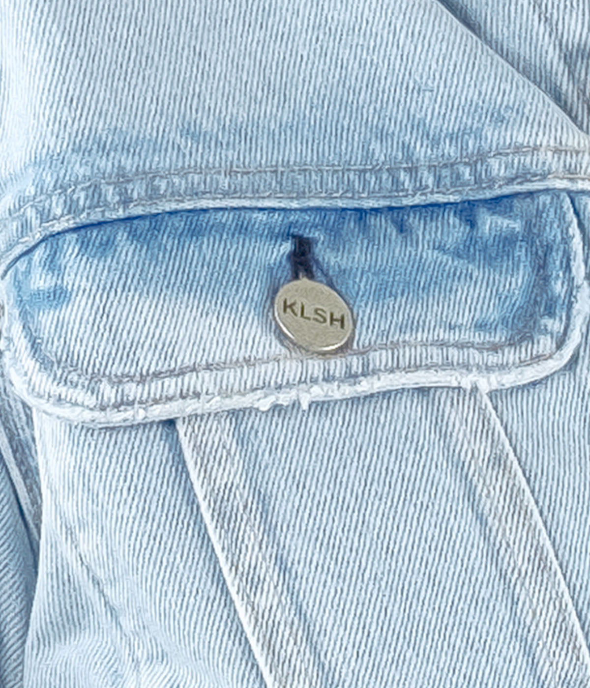 Light blue denim jacket with a brand logo on the chest pocket